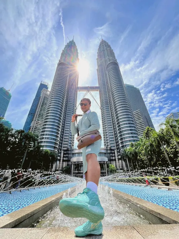 Merald Ayson in front of city skyscrapers